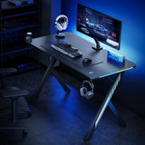 NanoRS gaming bureau, zwart, met koptelefoon- en bekerhouder, RGB-achtergrondverlichting, max. 75kg, afmetingen 1200x600x750mm, RS102